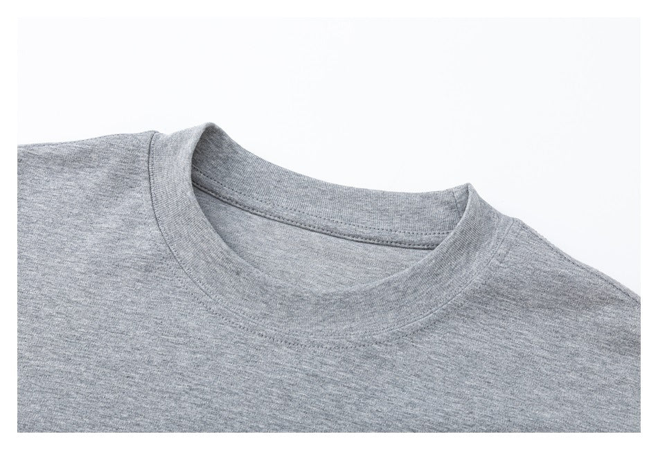 Close-up of the heather gray shirt's crew neckline and shoulder seams.