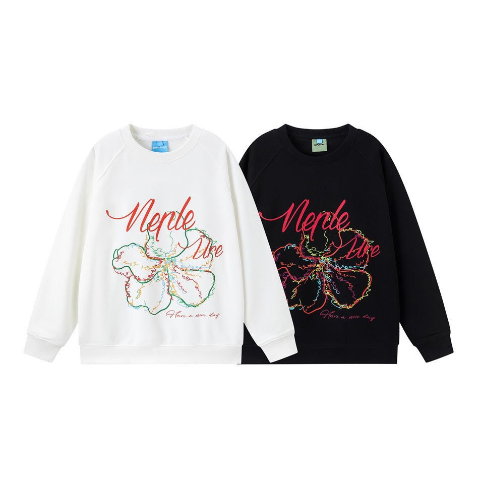 White and black crewneck sweatshirts with colorful flower graphics and script on the front.