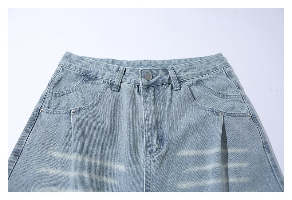 Front view of light-wash jeans showing the waistband, pockets, button and faded horizontal areas.