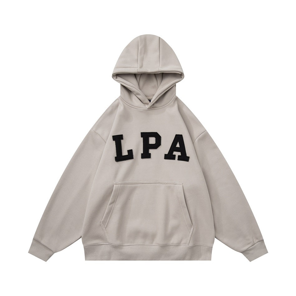 Beige pullover hoodie with black LPA appliqué letters across the chest and a front kangaroo pocket