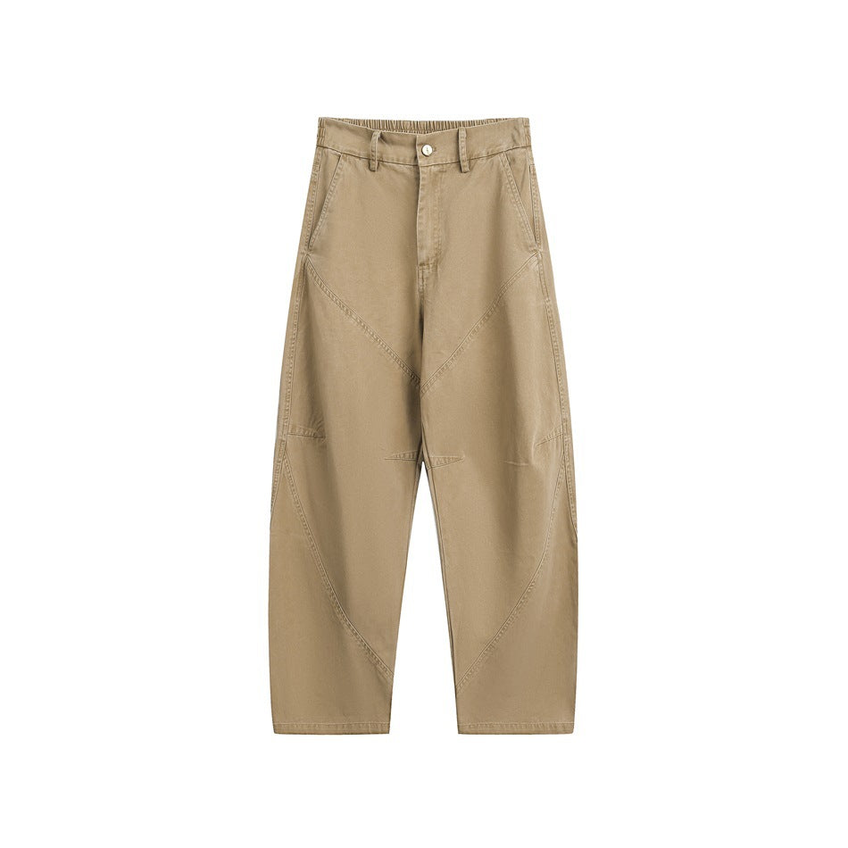 Khaki wide-leg pants with diagonal seams, button fly, belt loops and slanted side pockets, flat front view