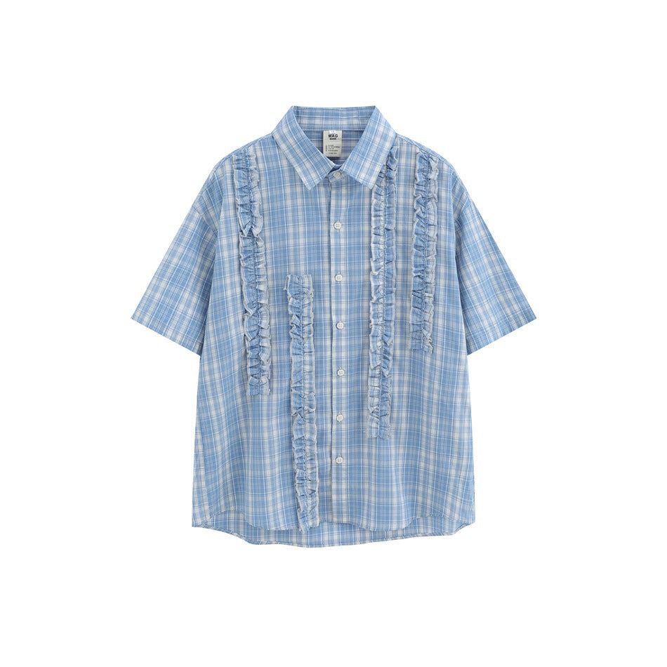 Light blue plaid short-sleeve button-up shirt with vertical ruffle trim strips on the front, flat lay