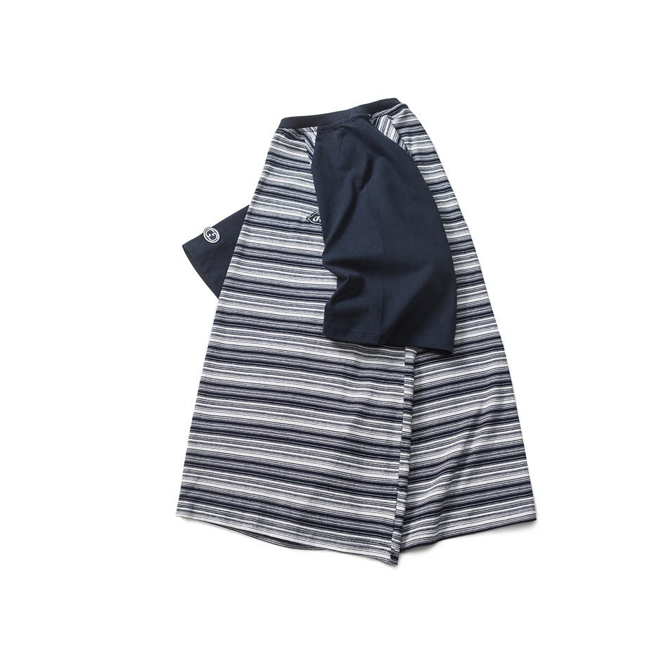 Folded navy-and-white striped short-sleeve T-shirt with solid navy sleeves and a small chest emblem.