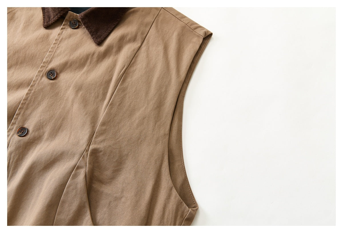 Partial front view of a tan sleeveless button-front vest with a dark brown collar.