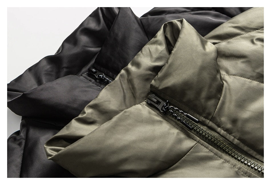 Close-up of black and olive jackets showing fabric panels and black zipper hardware.