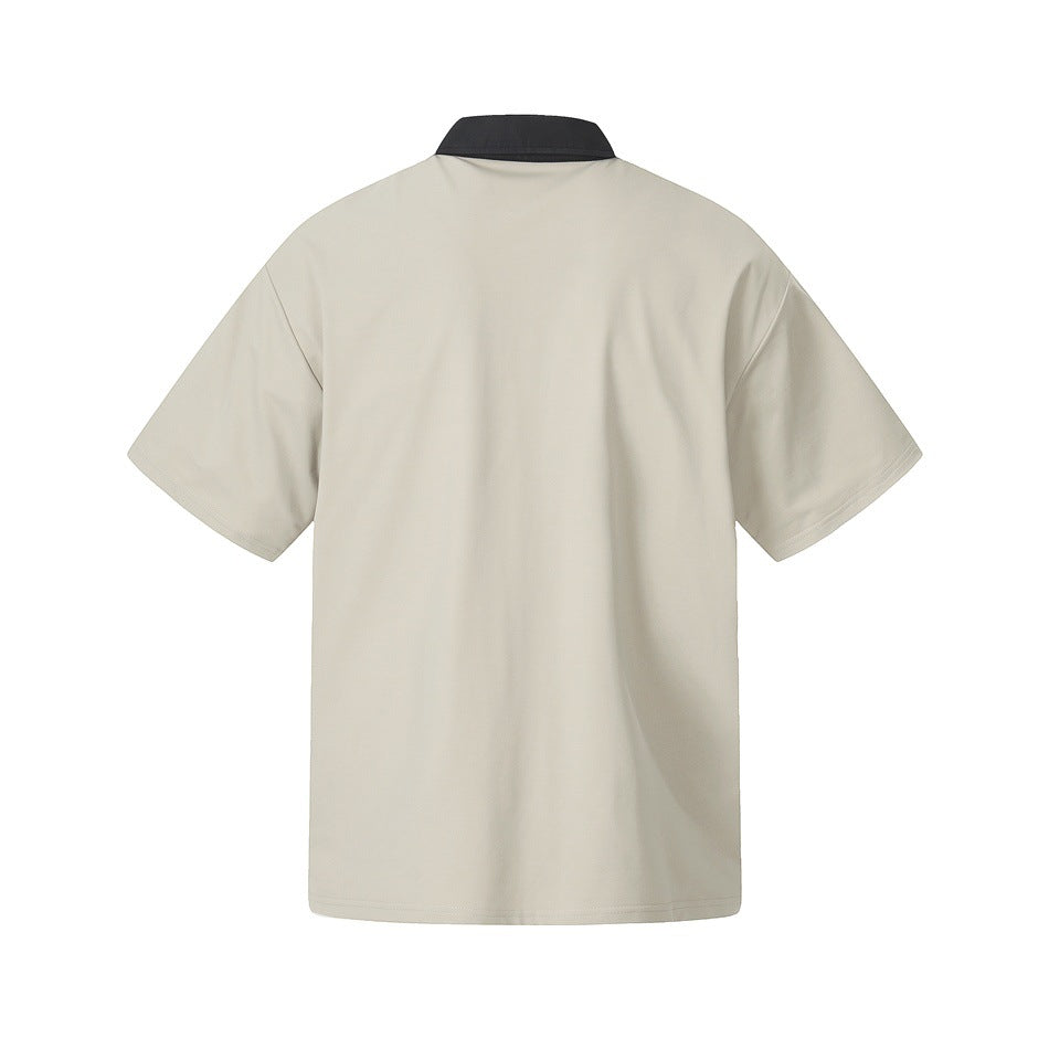Back view of a light beige short-sleeve polo with a black collar.