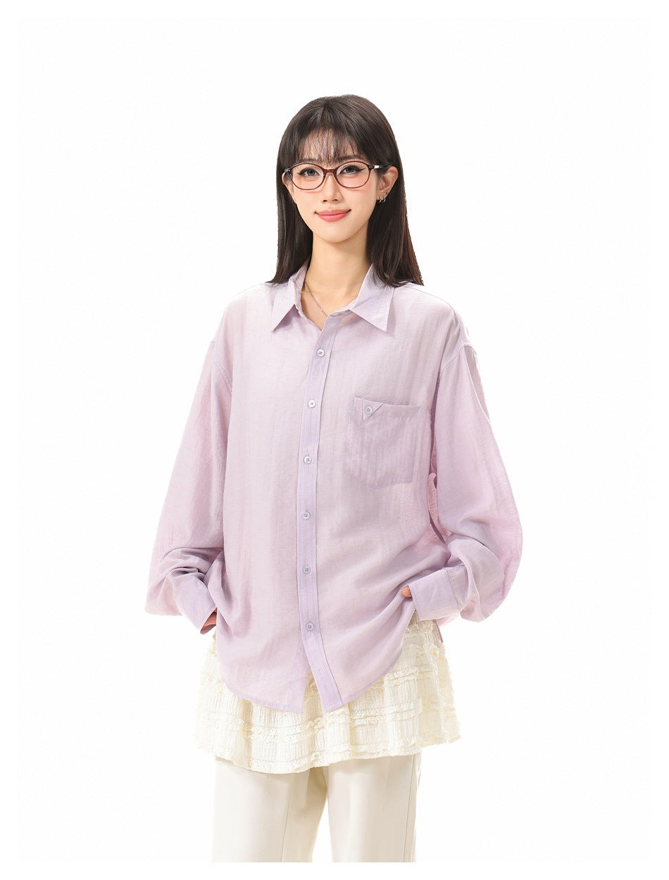Front view of a model wearing an oversized pale lavender button-up shirt with a single chest pocket.