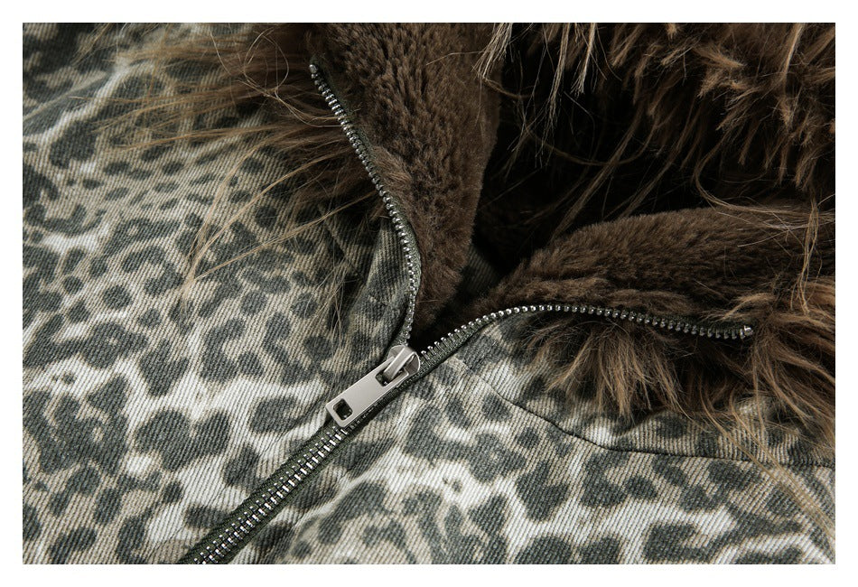 Close-up of an olive and gray animal-print jacket with a brown faux-fur collar and metal zipper.