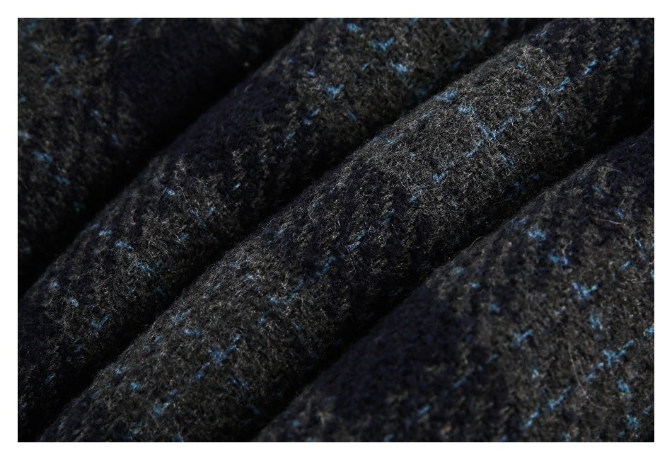 Close-up showing the fuzzy, mottled charcoal fabric and scattered blue flecks.