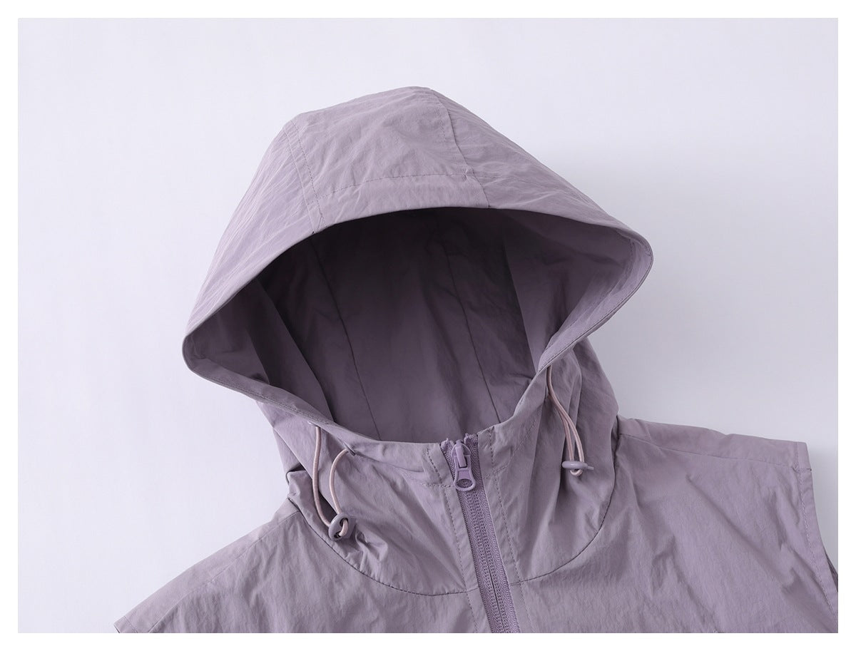 Close-up of a lavender jacket hood, adjustable drawcords, and front zipper.