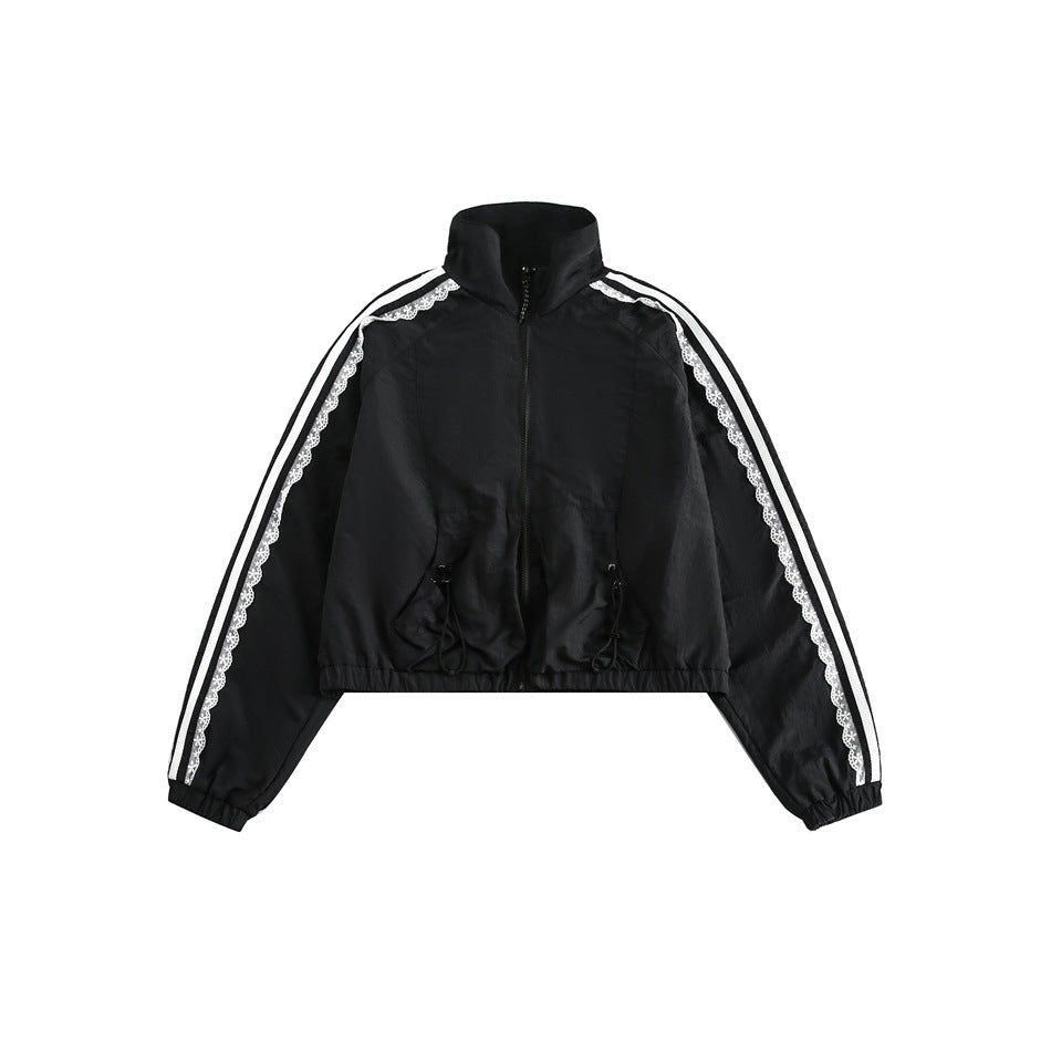 Black cropped zip jacket with white sleeve stripes and lace trim, stand collar and drawcord waist, front flat view
