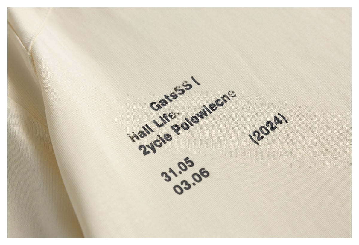 Close-up of black text printed on cream fabric.