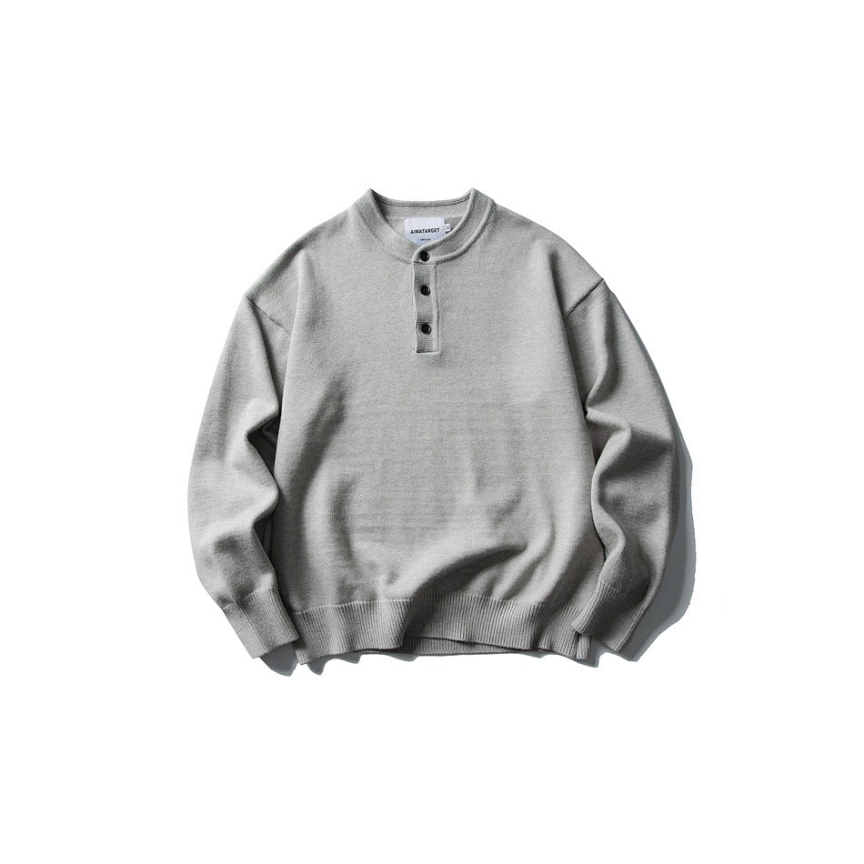Light gray knit Henley-neck sweater with three buttons, flat lay front view