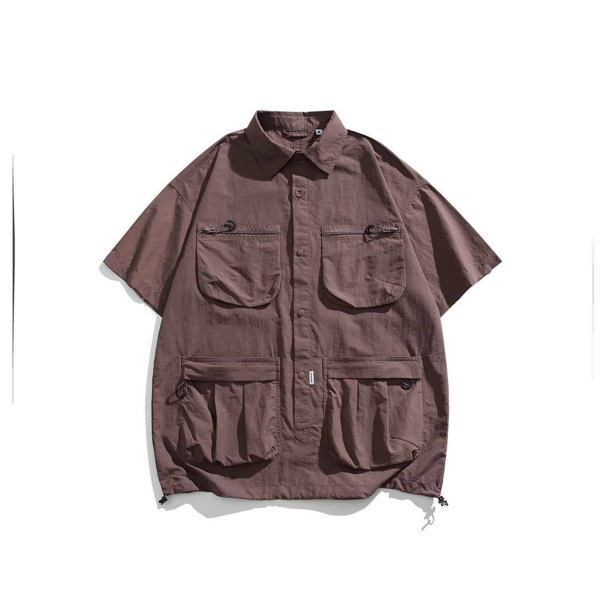 Dusty mauve-brown short-sleeve utility shirt flat lay with four flap pockets and button front