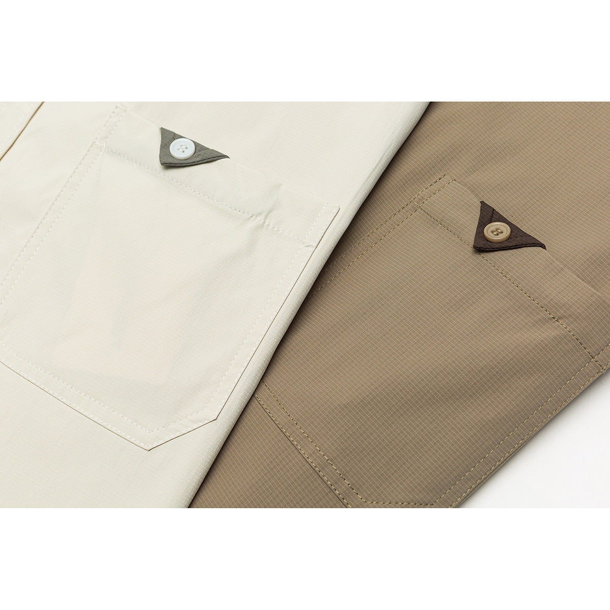 Close-up comparing ivory and taupe shirt chest pockets, each with a button on a small contrasting fabric tab.
