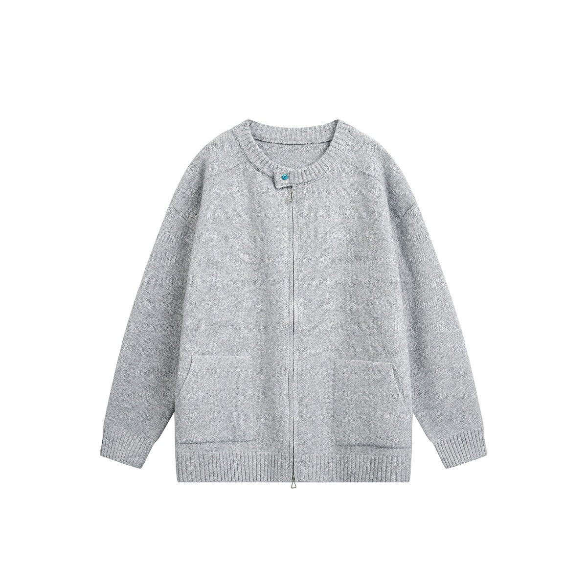 Light gray knit zip-front cardigan with ribbed round neck, turquoise button, two front pockets and ribbed hem, flat lay