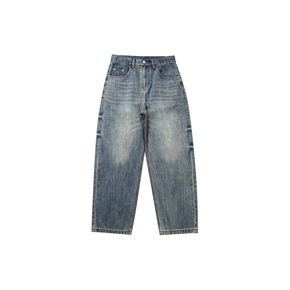 Front flat lay of washed blue whiskered denim jeans with button waist, zip fly and five pockets