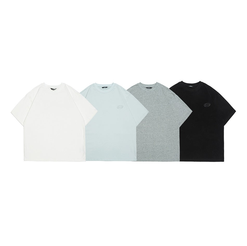 Four short-sleeve crewneck T-shirts shown from the front in white, pale blue, heather gray, and black.