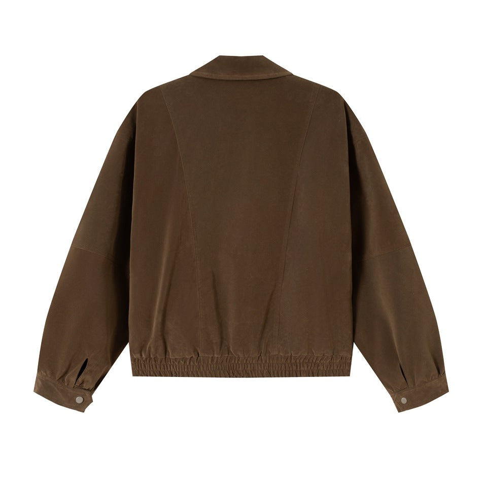Back view of a brown jacket with a wide collar, long sleeves, gathered elastic hem and buttoned cuffs.