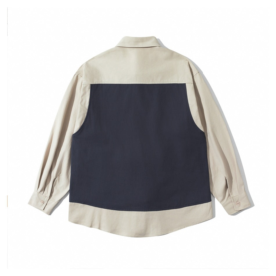 Back view of a cream long-sleeve shirt with a large rectangular navy panel across the back.