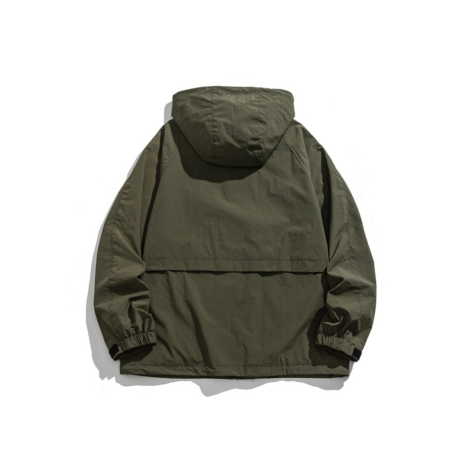 Back view of an olive hooded jacket with elastic cuffs and a horizontal back flap.
