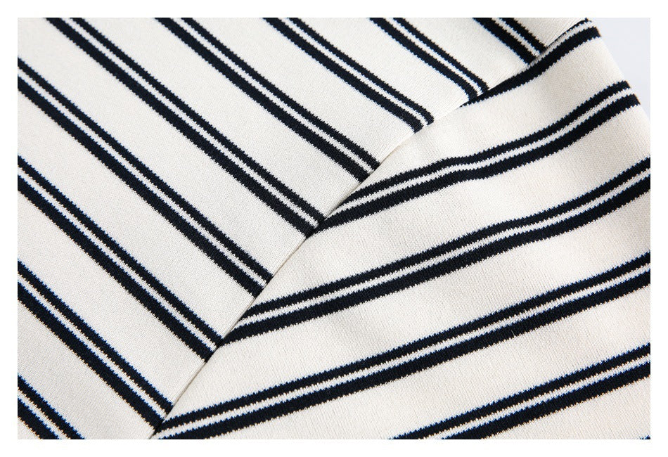 Close-up of the striped garment's overlapping neckline and seam.