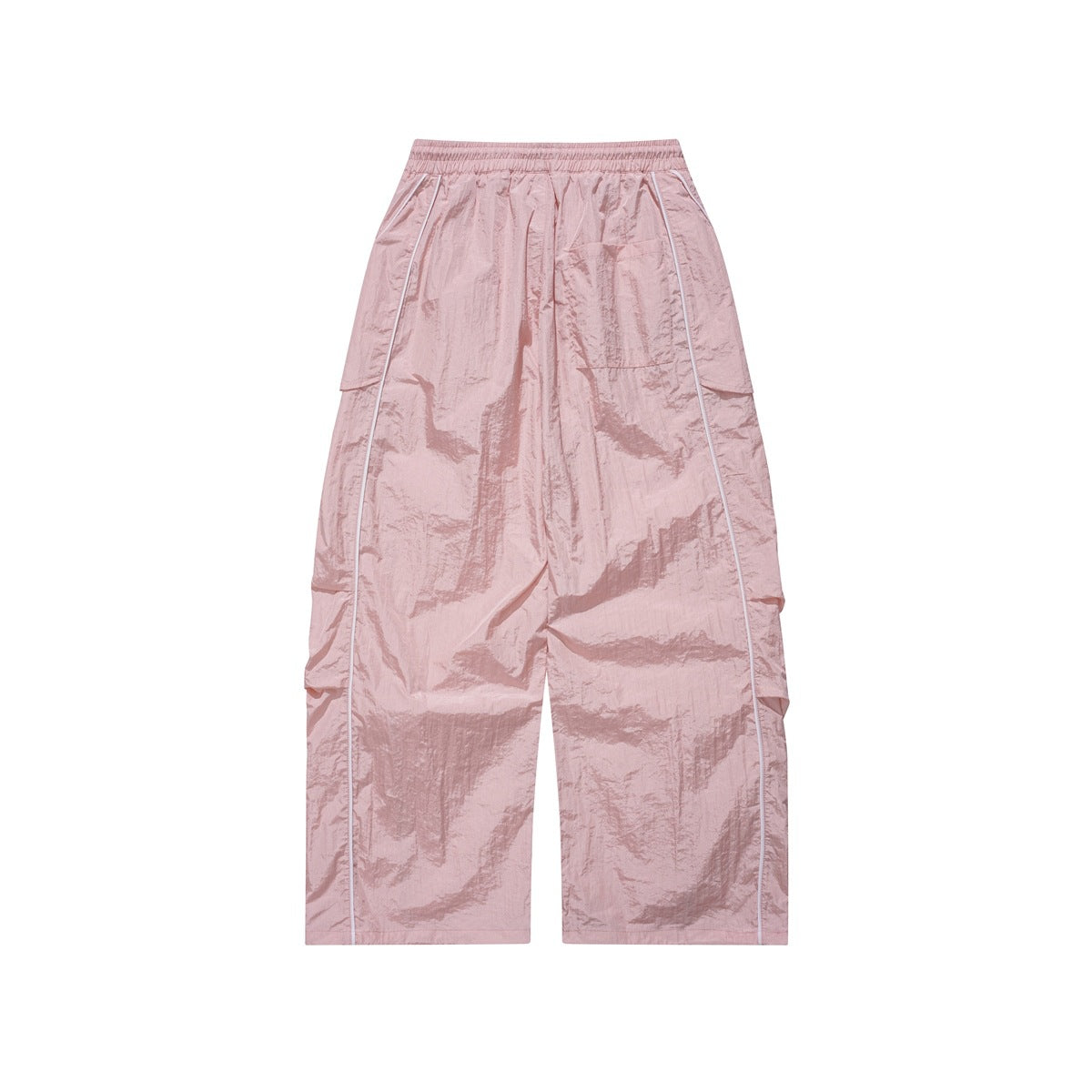 Front view of dusty pink wide-leg pants with an elastic waist, side flap pockets and white piping.