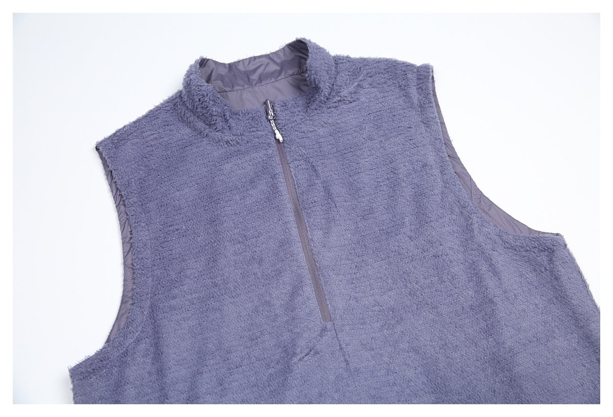 Flat lay of a lavender-gray sleeveless fleece vest with a stand collar and front zipper.