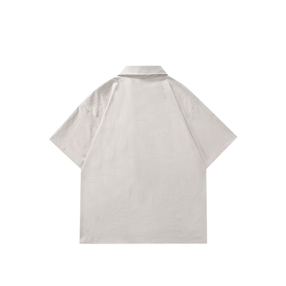 Back view of a light ivory short-sleeve collared shirt with a plain back.