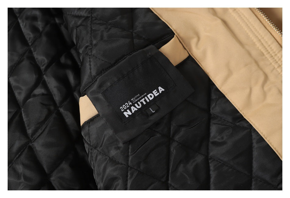 Close-up of the jacket's black quilted lining and a sewn-in NAUTIDEA label.