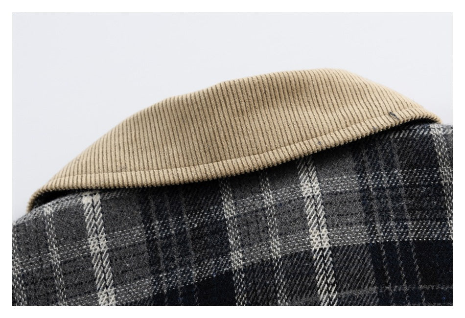 Close-up of a tan ribbed collar above the black and gray plaid fabric of a garment.