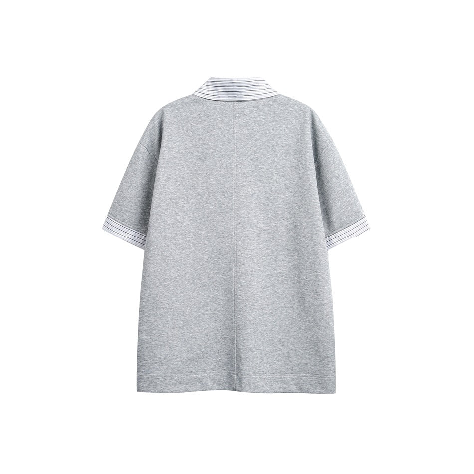 Back view of a light gray short-sleeve top with a striped collar and striped sleeve cuffs.