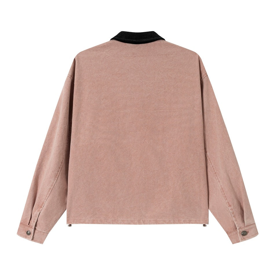 Back view of a dusty pink jacket with long sleeves and a black ribbed collar.