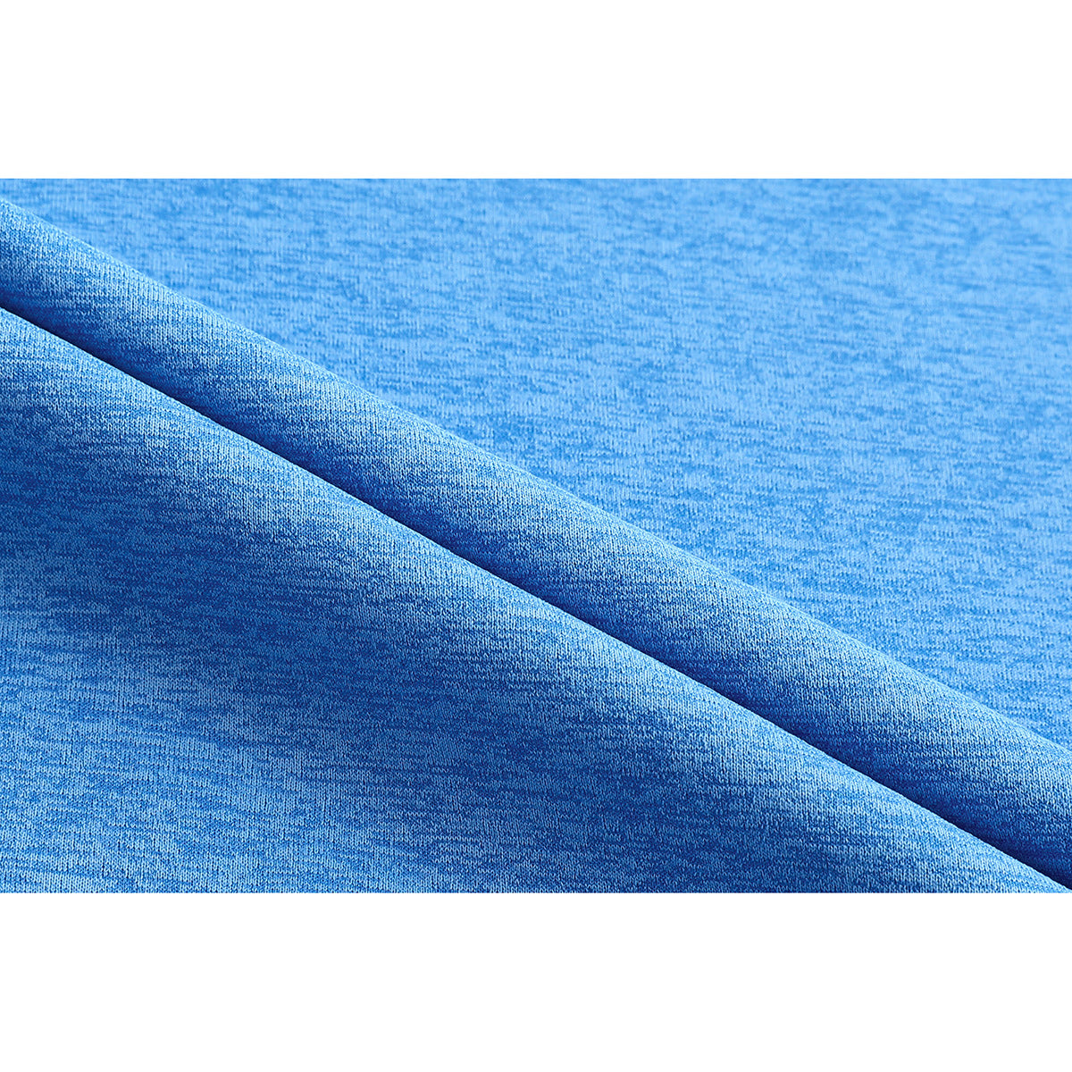 Close-up of blue heathered T-shirt fabric folded to show its surface and texture.