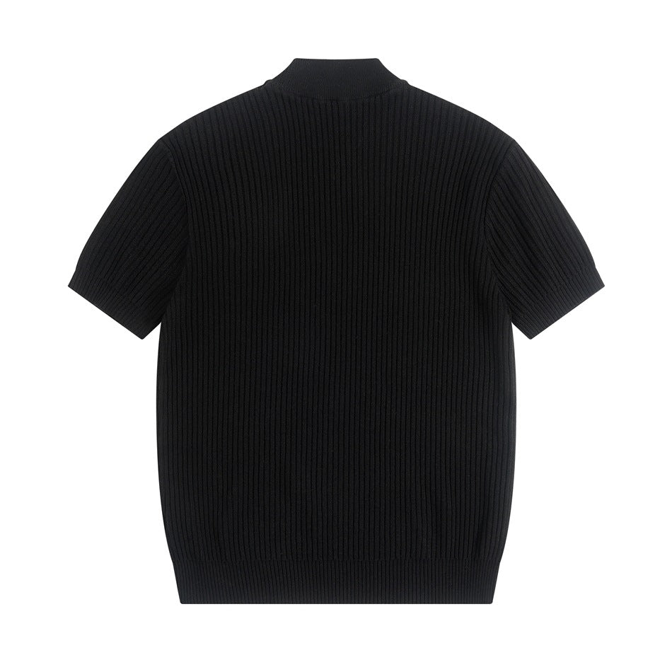 Back view of a black short-sleeve ribbed knit top with mock neckline, flat lay on white background