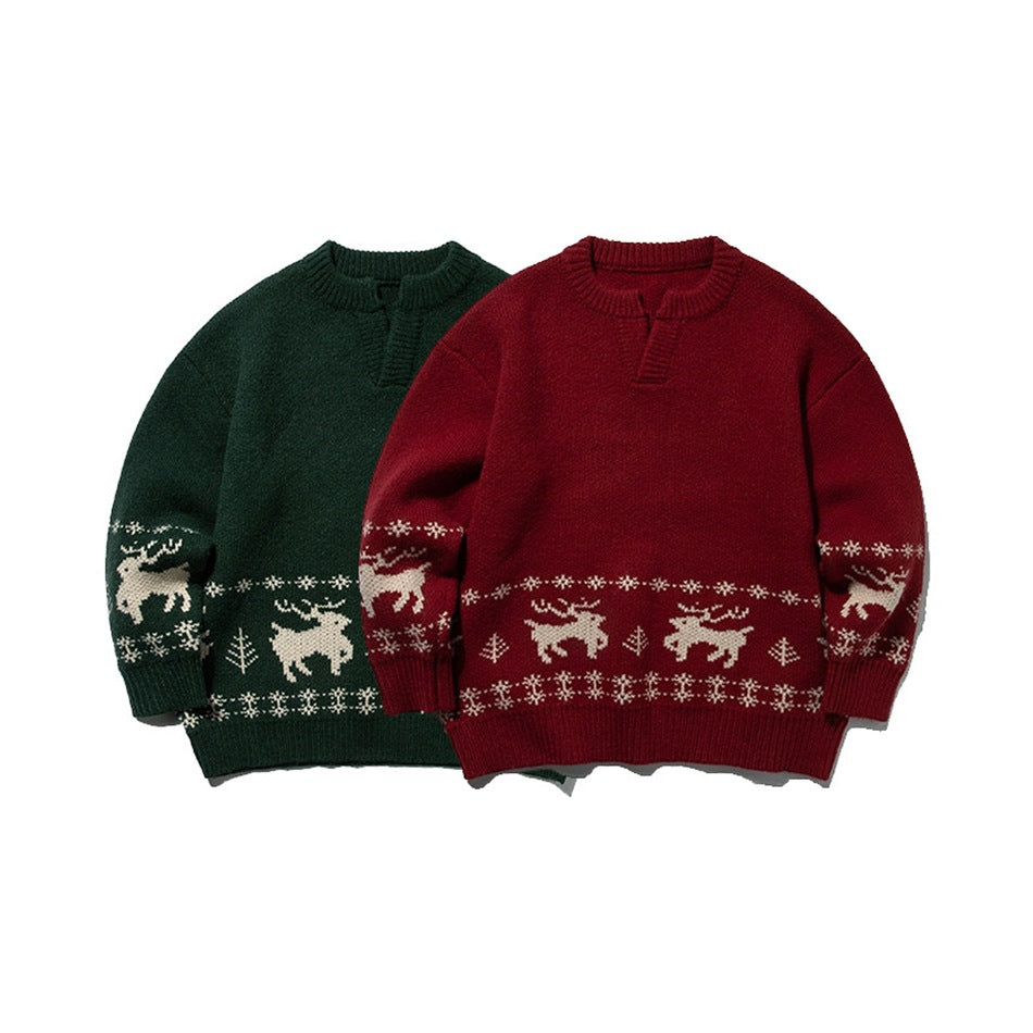 Front view of burgundy and dark green sweaters with cream reindeer and winter motifs.