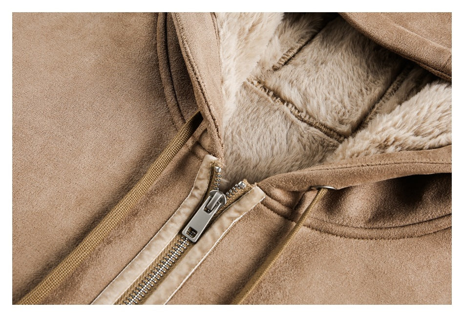 Close-up of the tan jacket's open collar, pale plush lining, and metal front zipper.
