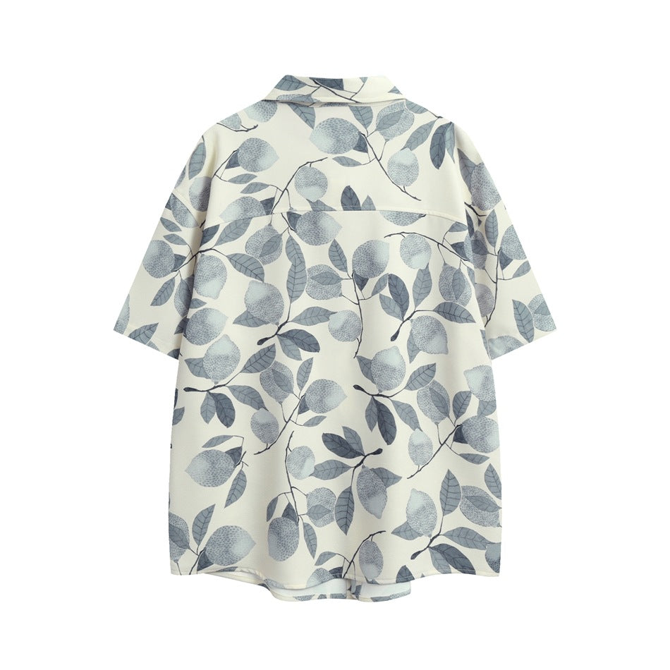 Back view of an ivory short-sleeve button-up shirt with a gray lemon-and-leaf print.