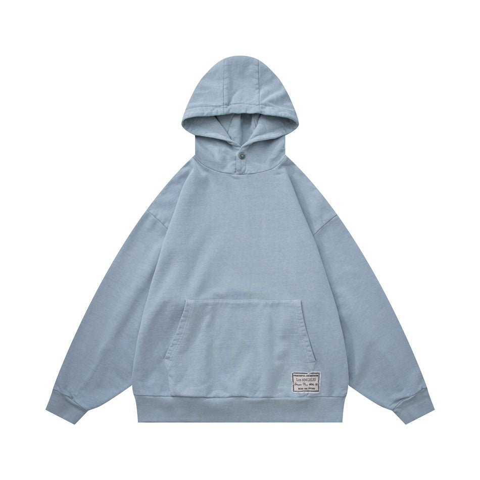 Light blue pullover hoodie, front flat lay, with kangaroo pocket, ribbed cuffs and a small woven label