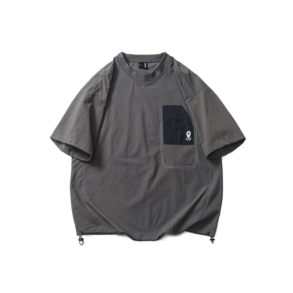 Gray short-sleeve T-shirt flat lay with black chest pocket, white stitching and drawcord hem toggles