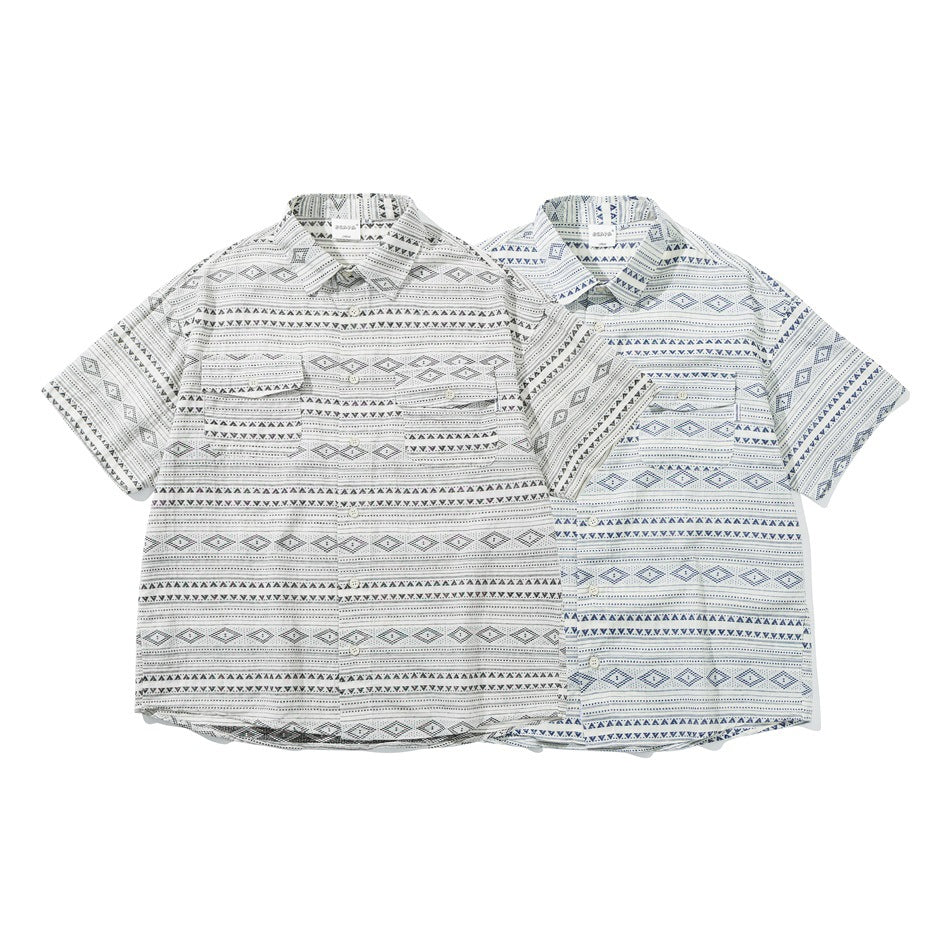 Two short-sleeve button-up shirts with geometric stripes, one white with black patterns and one white with blue patterns.
