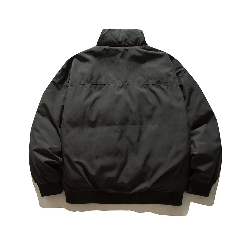 Back view of a black zip-up jacket with a stand collar, long sleeves, and ribbed cuffs and hem.