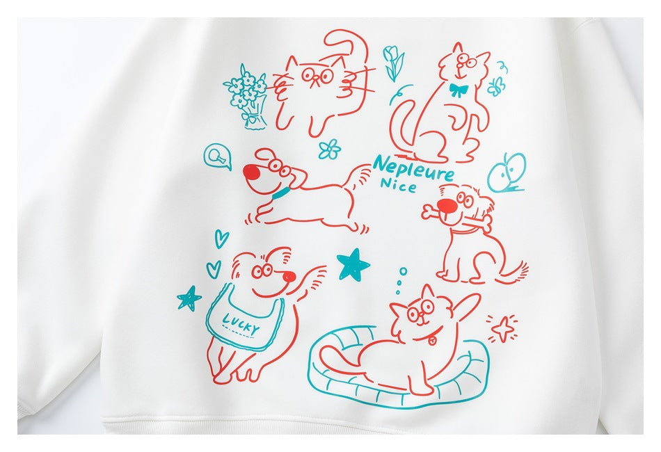 Close view of a white sweatshirt front with colorful hand-drawn cats, a dog, flowers and English lettering.