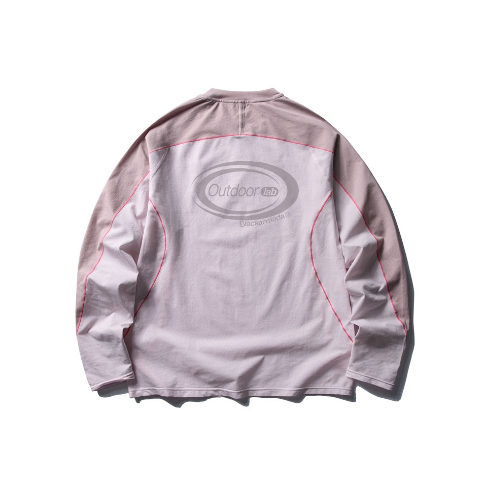 Back of a pale pink and gray long-sleeve top with pink contrast stitching and a large back logo.