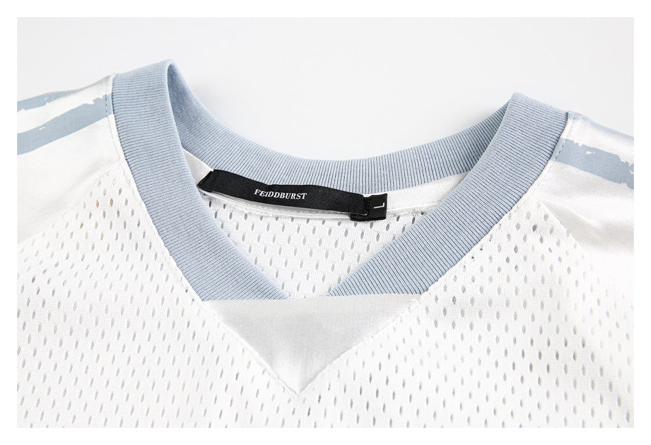 Close-up of a white mesh jersey's pale blue-gray V-neck trim and inner collar label.