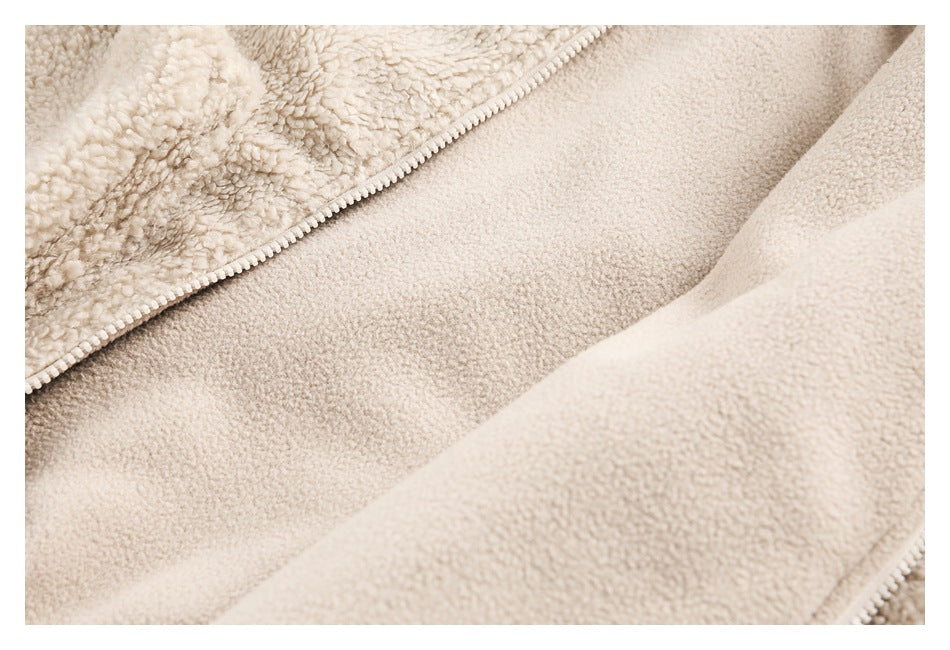 Close-up of the jacket's smooth beige inner surface beside its zipper seam.