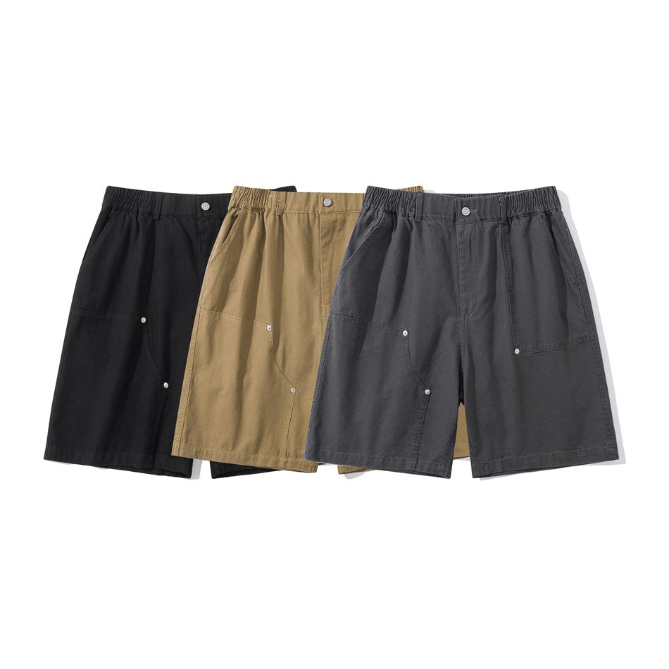 Three pairs of shorts shown from the front in black, tan, and charcoal gray.