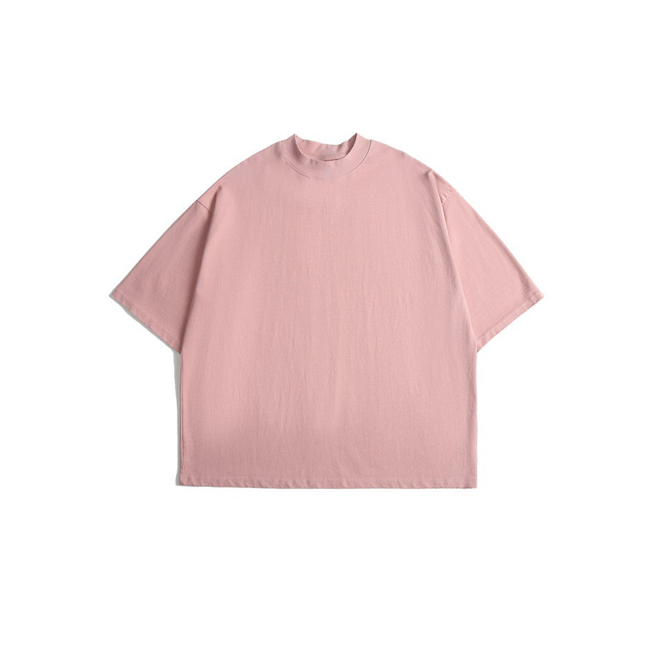 Pink short-sleeve oversized T-shirt with a high ribbed crew neck, laid flat, front view
