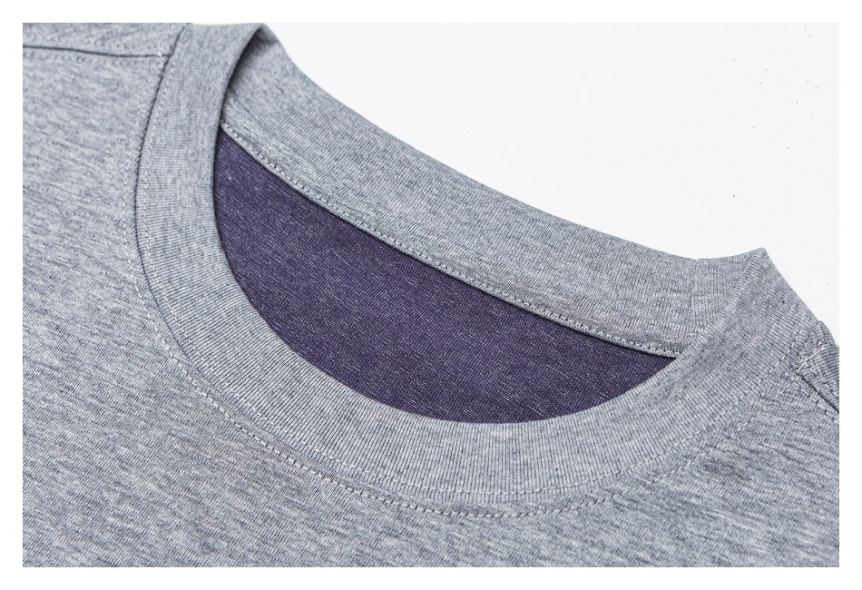 Close-up of a heather gray crew neckline with dark purple inner fabric.