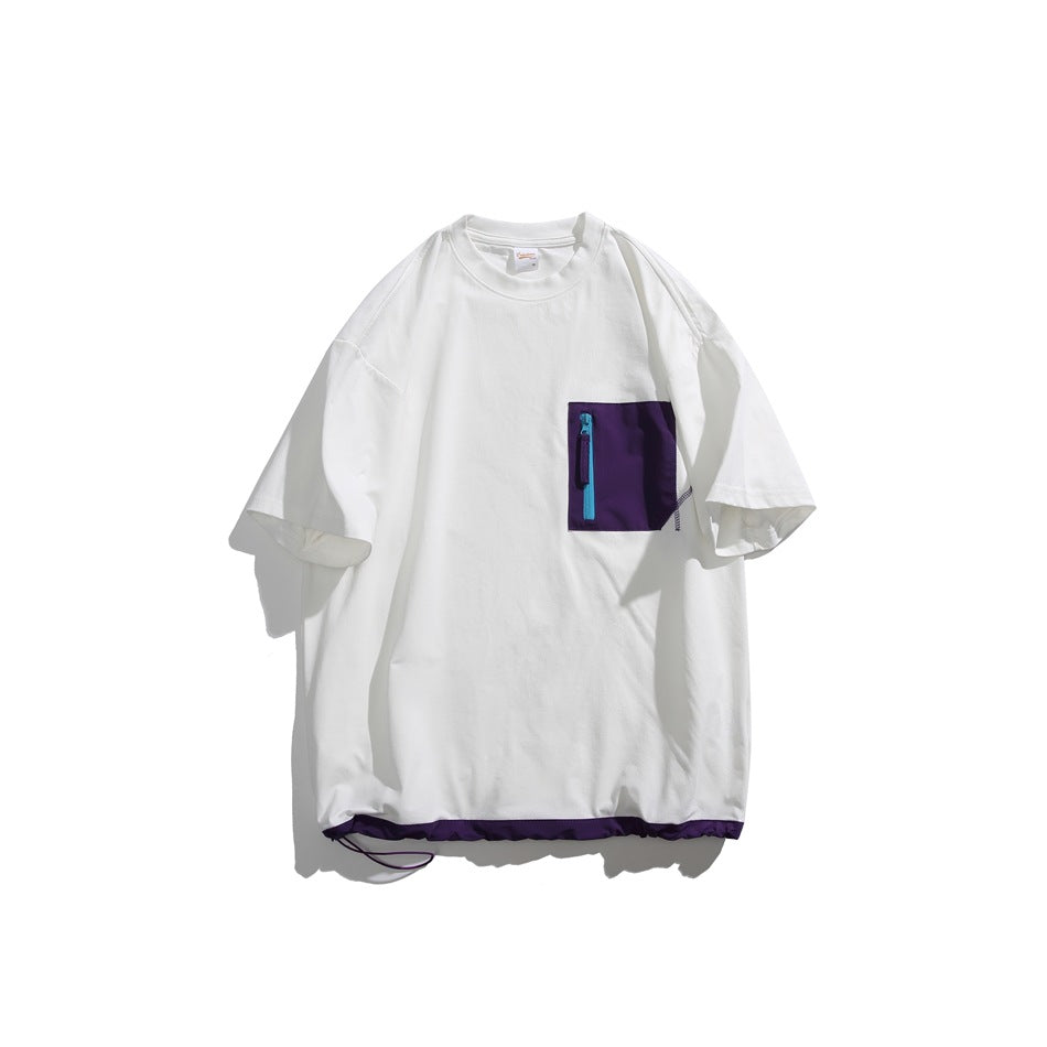 Front view of a white oversized T-shirt with a purple chest pocket, bright blue zipper, and purple hem trim.